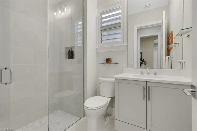 a utility room with sink dryer and washer