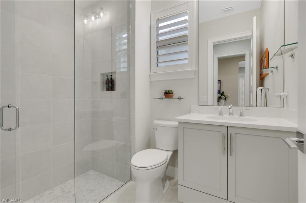 6253 Antigua Way Naples, FL 34113 - Photo 21 of 41 a bathroom with a sink toilet and shower