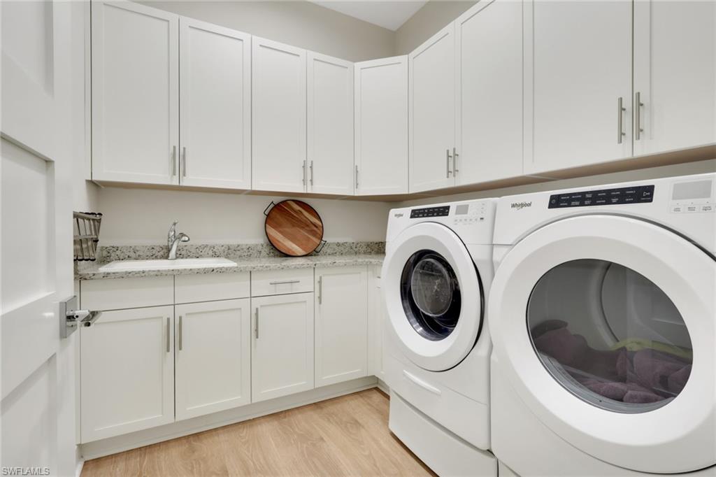 6253 Antigua Way Naples, FL 34113 - Photo 22 of 41 a utility room with sink dryer and washer