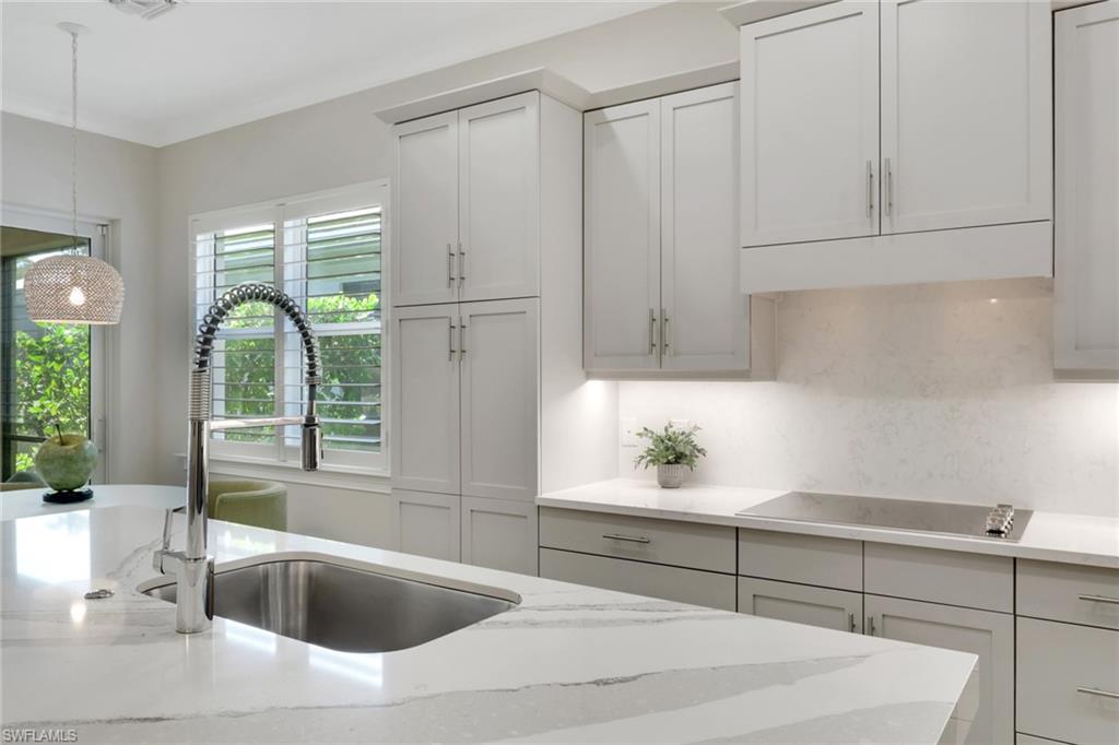 6253 Antigua Way Naples, FL 34113 - Photo 3 of 41 a kitchen with a sink and large window