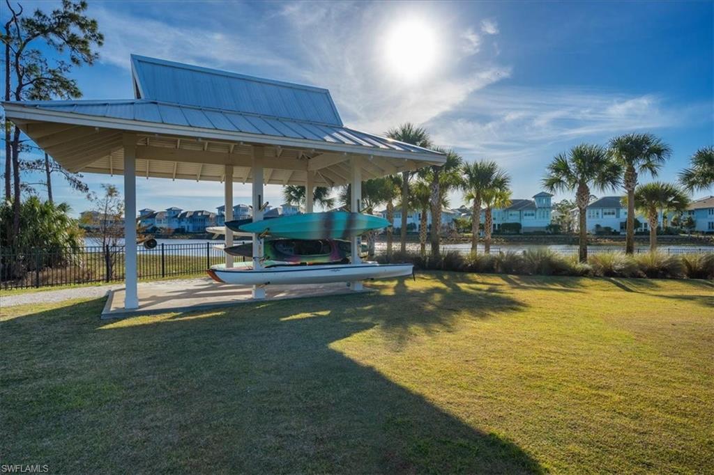 6253 Antigua Way Naples, FL 34113 - Photo 40 of 41 a view of a swimming pool with a patio