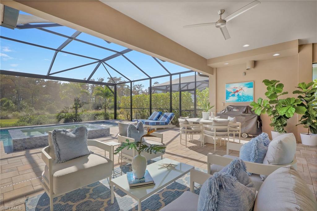 6253 Antigua Way Naples, FL 34113 - Photo 5 of 41 a living room with furniture and a large window