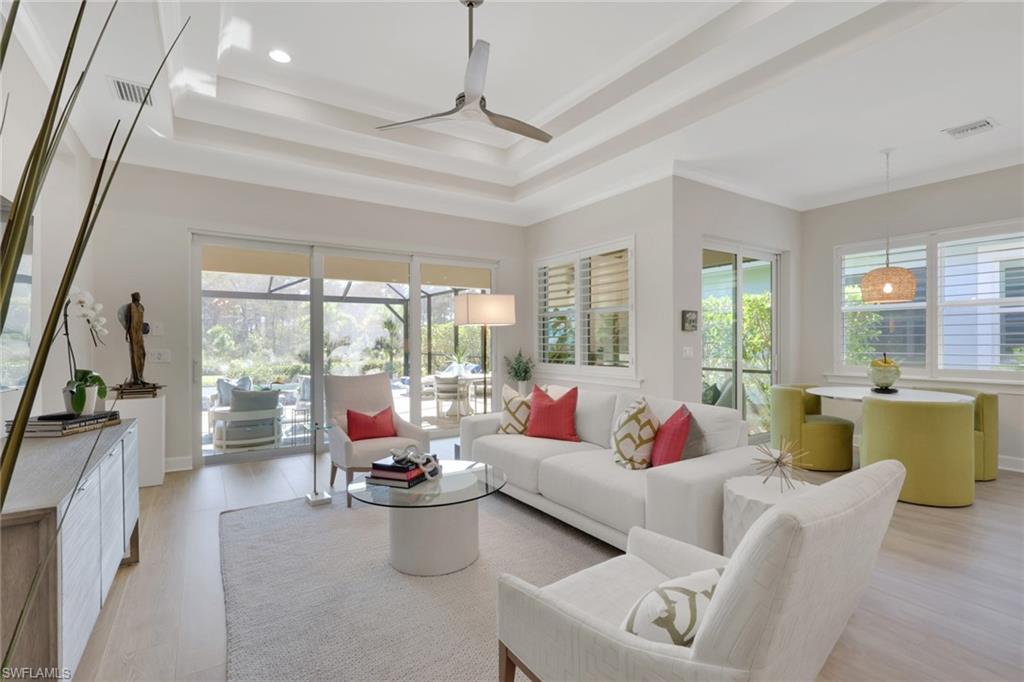 6253 Antigua Way Naples, FL 34113 - Photo 9 of 41 a living room with furniture and a large window