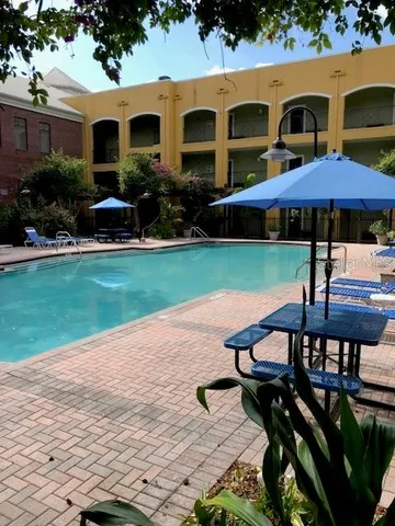 a front view of house with yard and outdoor seating