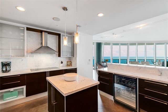 a living room with furniture tv and a large window