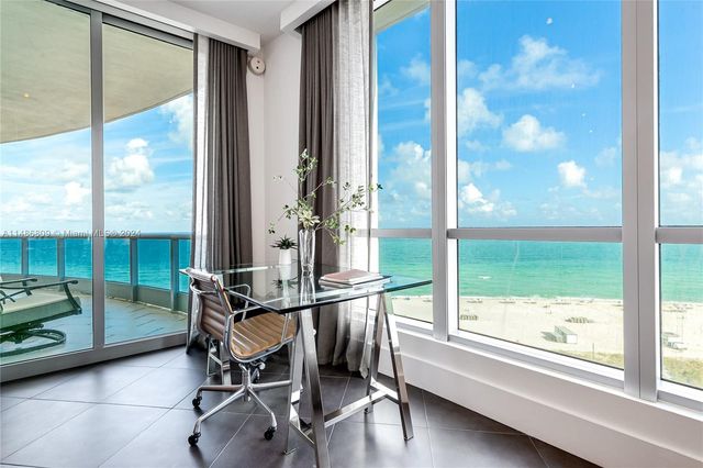 a bedroom with a bed and a flat tv screen