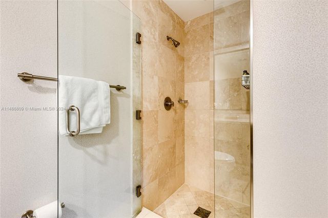 a bedroom with a bed and chair