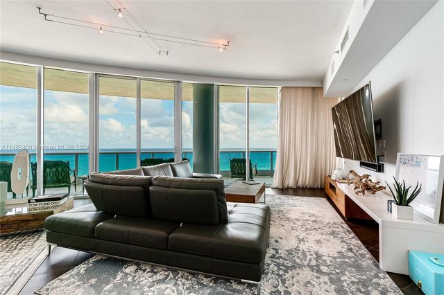 a bathroom with a toilet a sink and a mirror