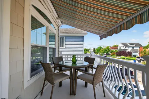 a view of a white house with a outdoor space