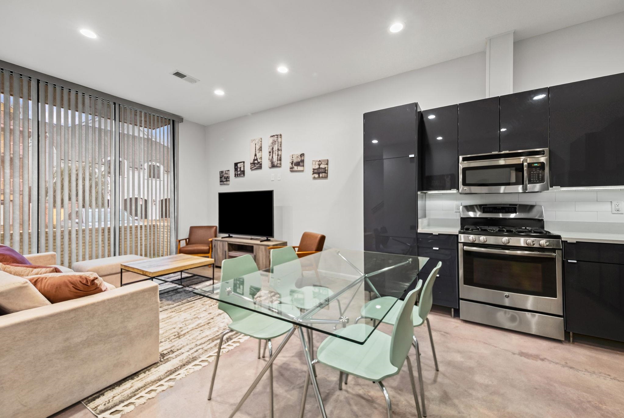 448 Tennessee Street Memphis, TN 38103 - Photo 34 of 39 a living room with furniture and a flat screen tv