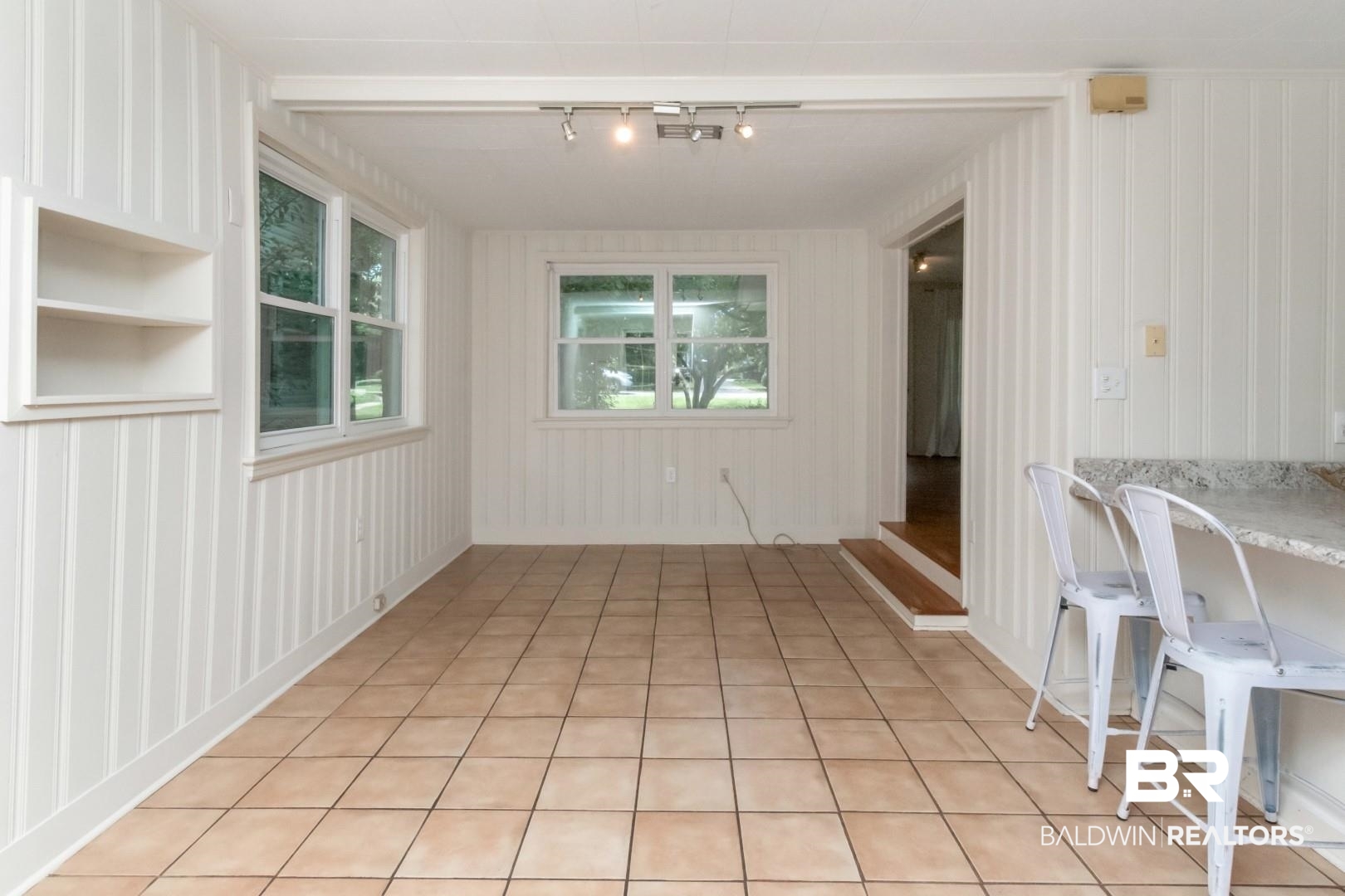 1906 Old Shell Road Mobile, AL 36607 - Photo 18 of 26 Unfurnished dining area featuring light tile patterned floors and track lighting