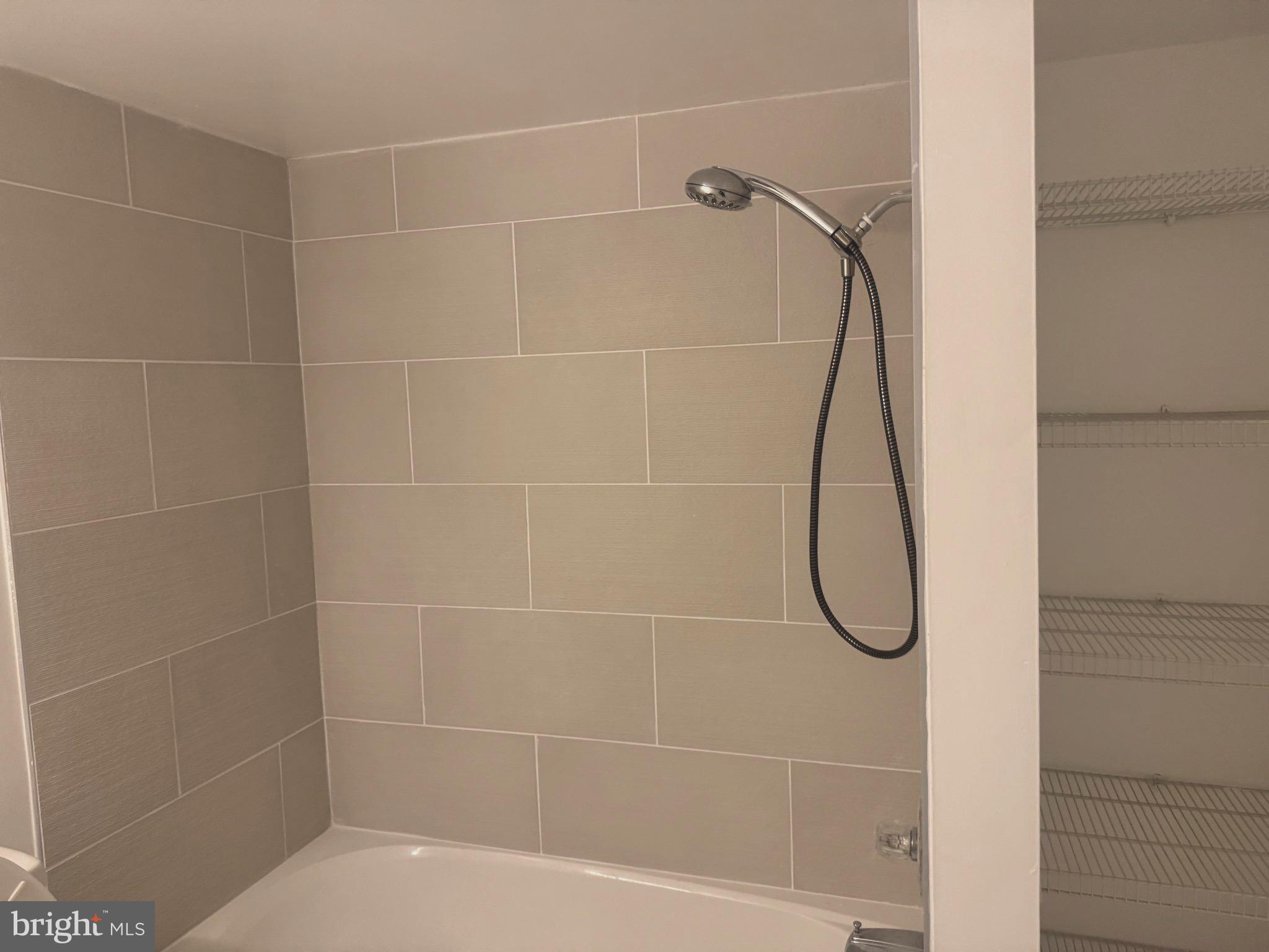 5890 Tulloch Spring Court Haymarket, VA 20169 - Photo 9 of 15 a bathroom that has a shower