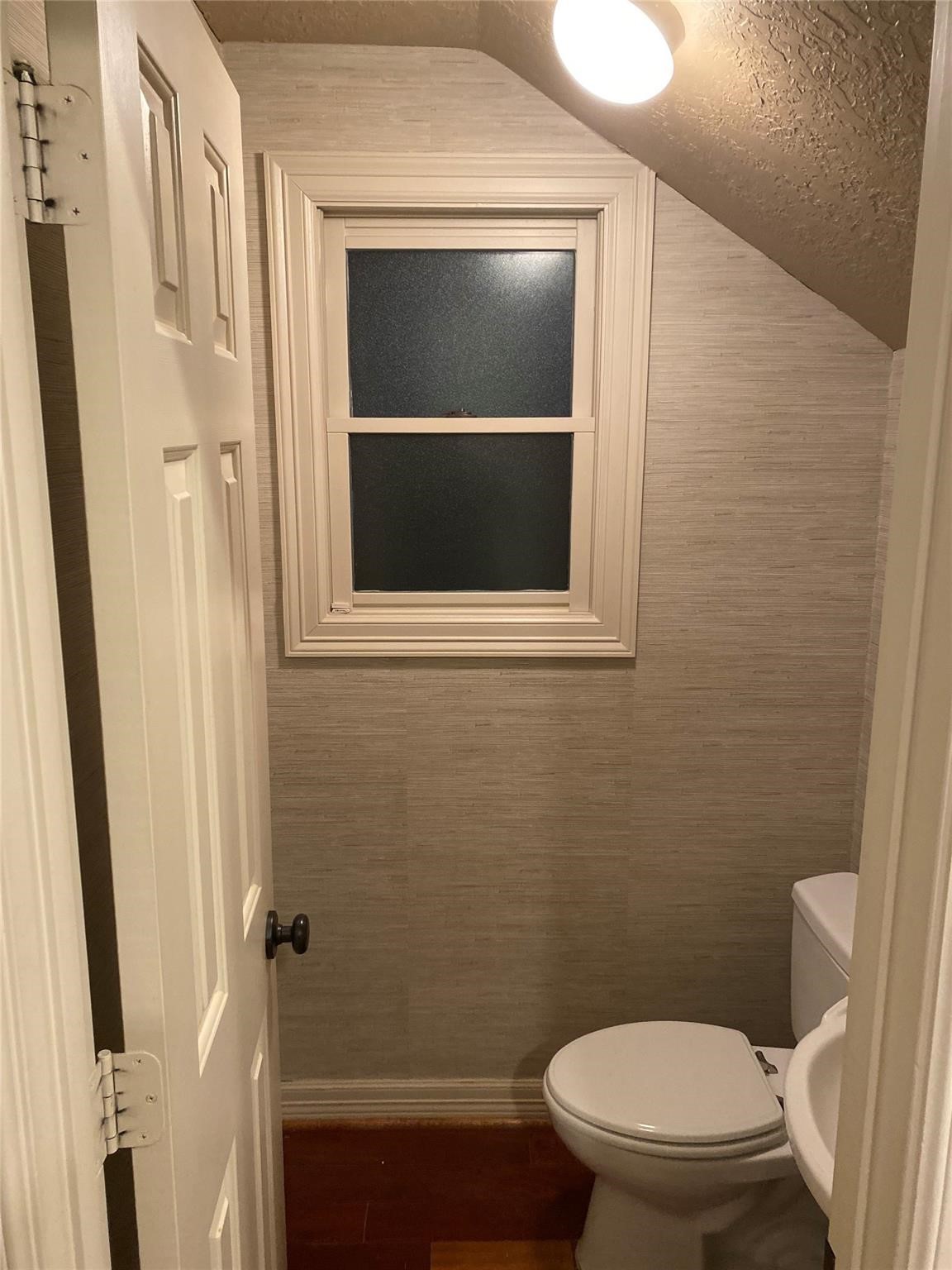 1324 Prince Street Houston, TX 77008 - Photo 11 of 26 a bathroom with a toilet and a sink