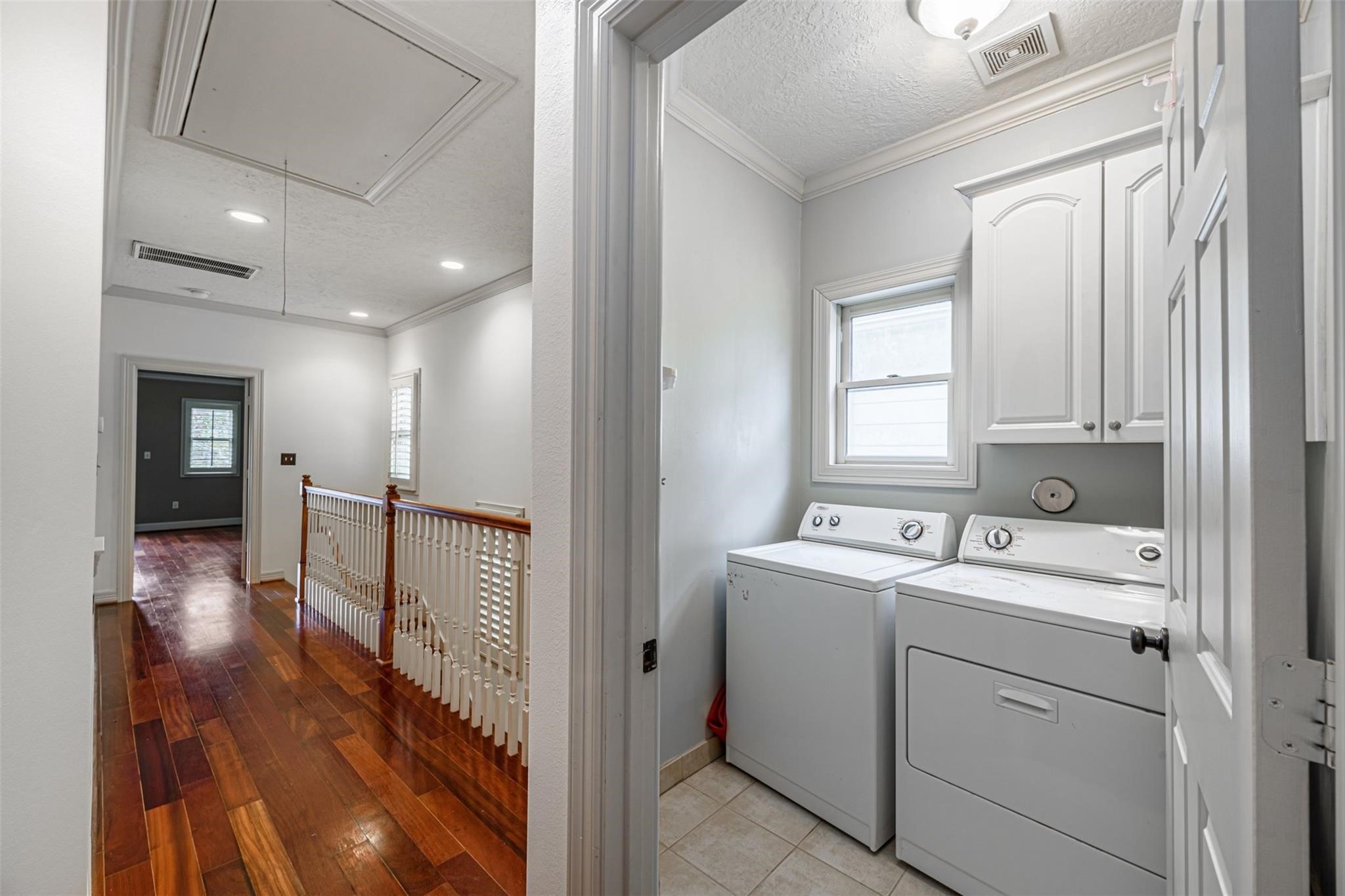 1324 Prince Street Houston, TX 77008 - Photo 14 of 26 a hallway view with wooden floor and utility room