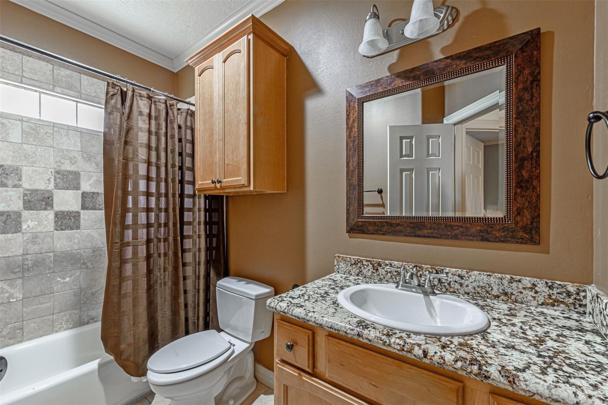 1324 Prince Street Houston, TX 77008 - Photo 15 of 26 a bathroom with a granite countertop sink toilet and shower