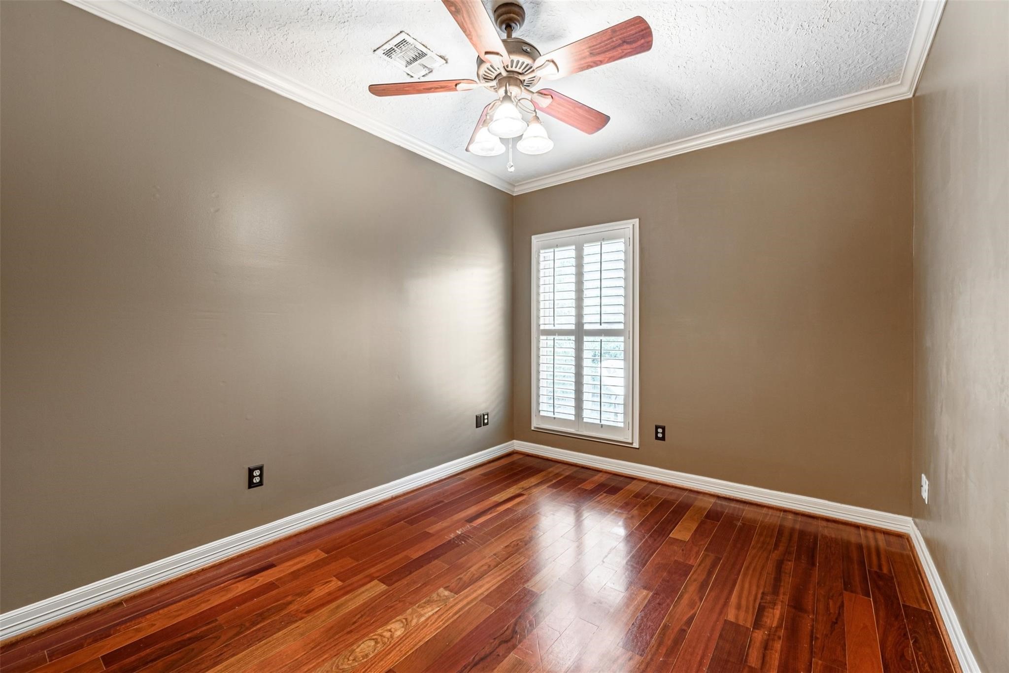 1324 Prince Street Houston, TX 77008 - Photo 16 of 26 wooden floor in an empty room with a window