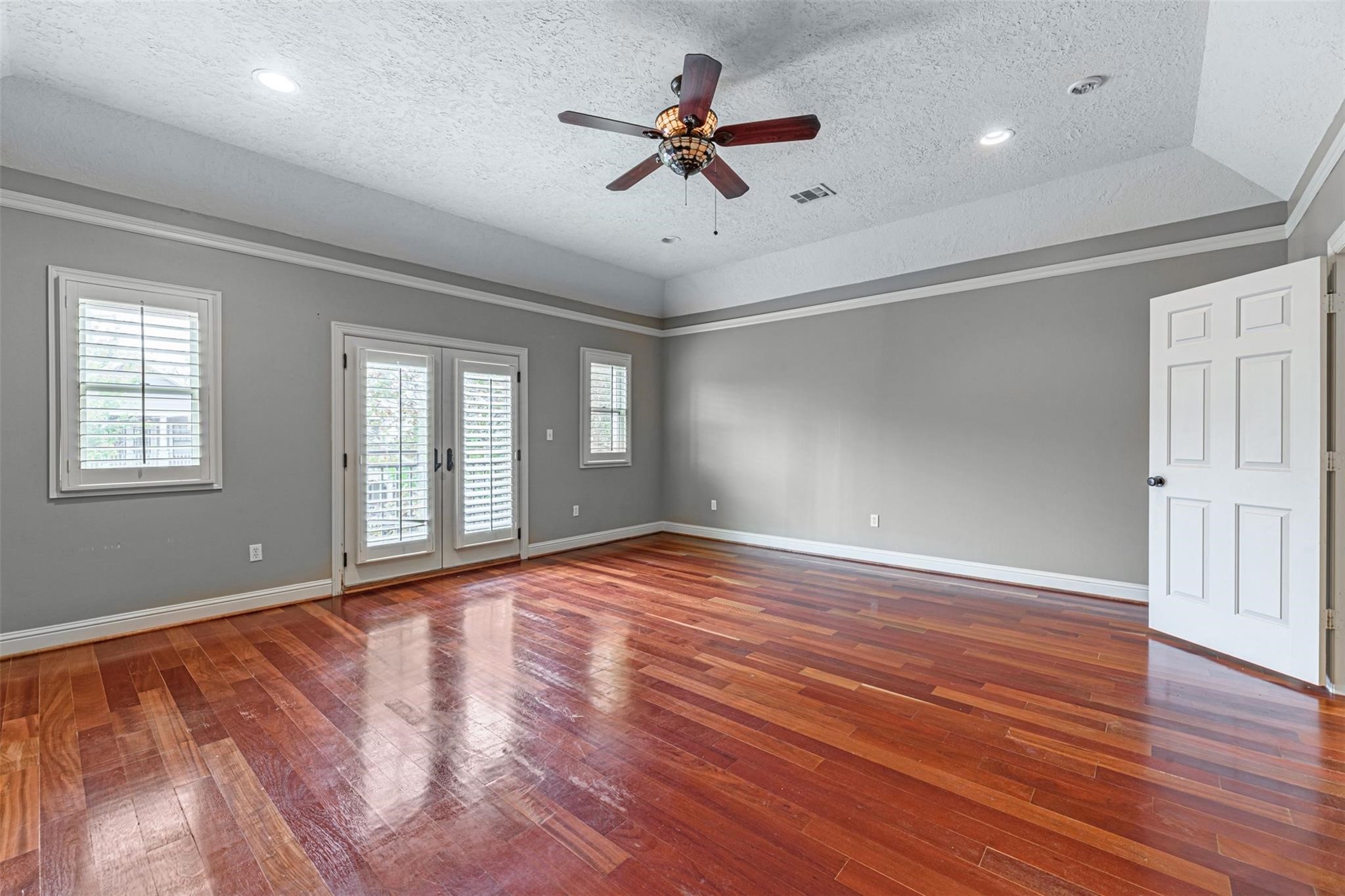 1324 Prince Street Houston, TX 77008 - Photo 17 of 26 a view of an empty room with a window and wooden floor