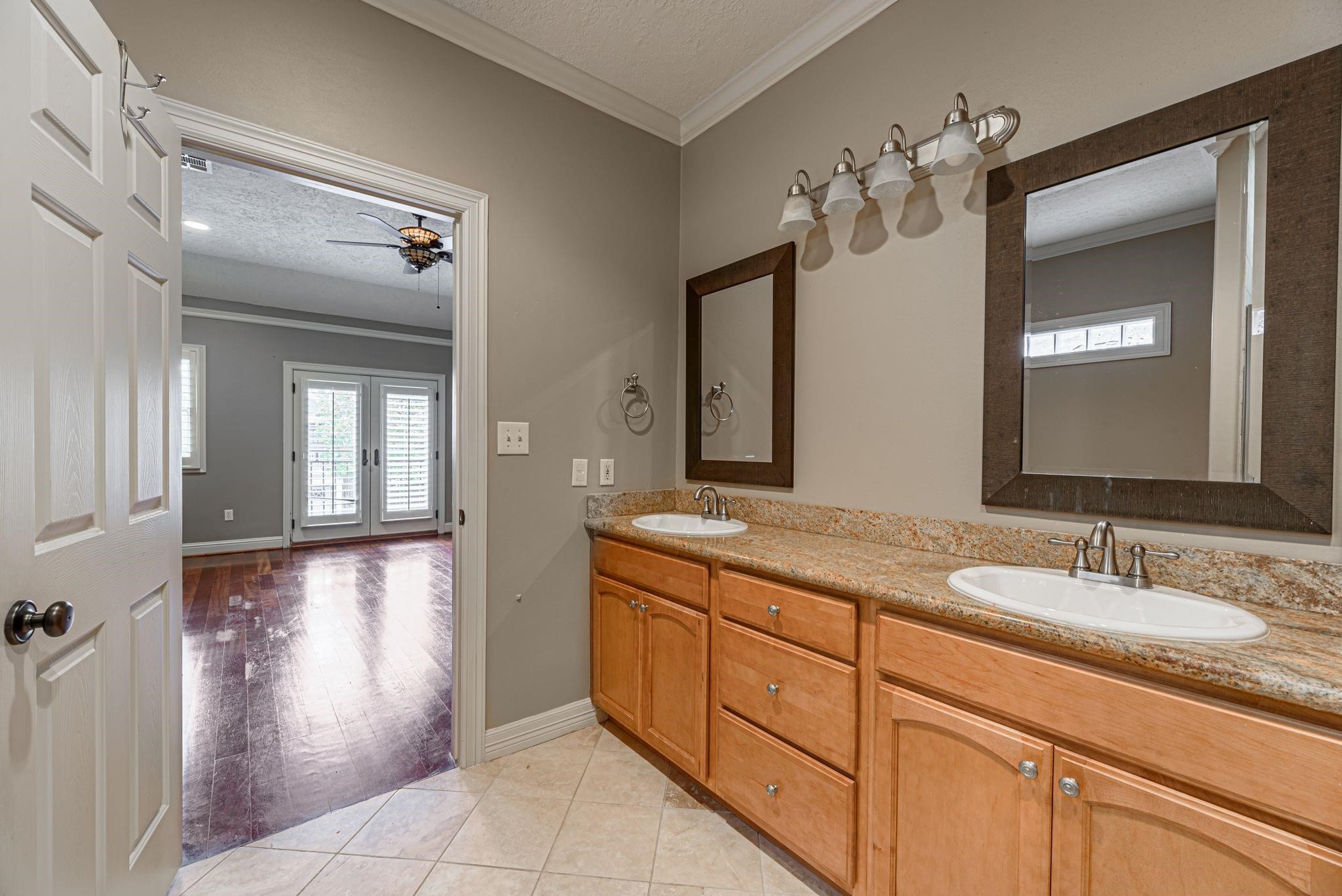 1324 Prince Street Houston, TX 77008 - Photo 22 of 26 a bathroom with a granite countertop sink a mirror and a vanity