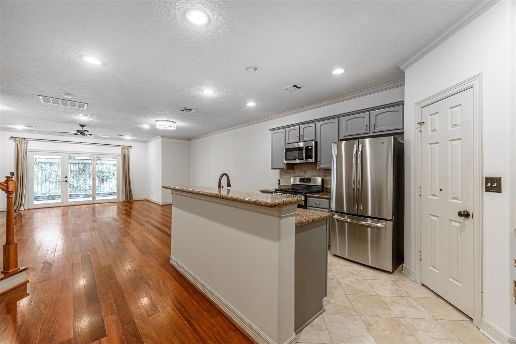 1324 Prince Street Houston, TX 77008 - Photo 6 of 26 a kitchen with stainless steel appliances granite countertop a refrigerator and a sink