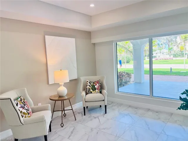 a view of a dining room with furniture and window