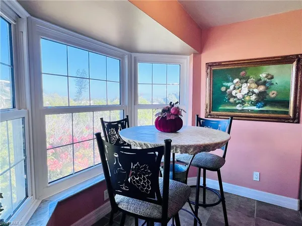 a kitchen with stainless steel appliances kitchen island granite countertop a stove a sink and a refrigerator