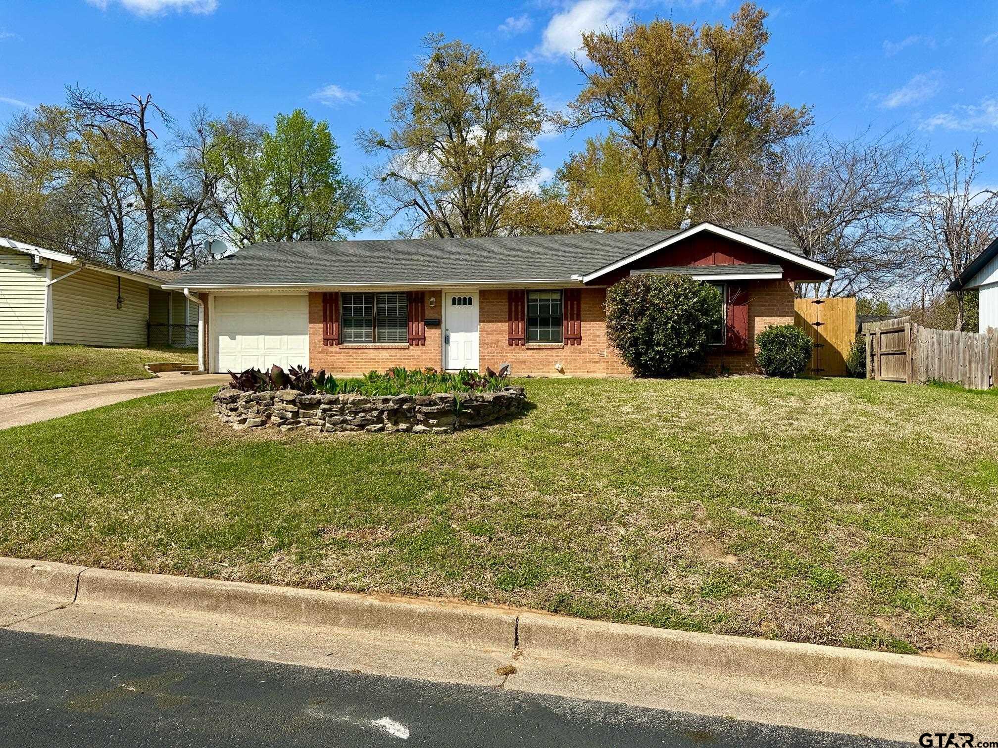 2412 East Devine Street Tyler, TX 75701 - Photo 1 of 27 a view of a house with a yard