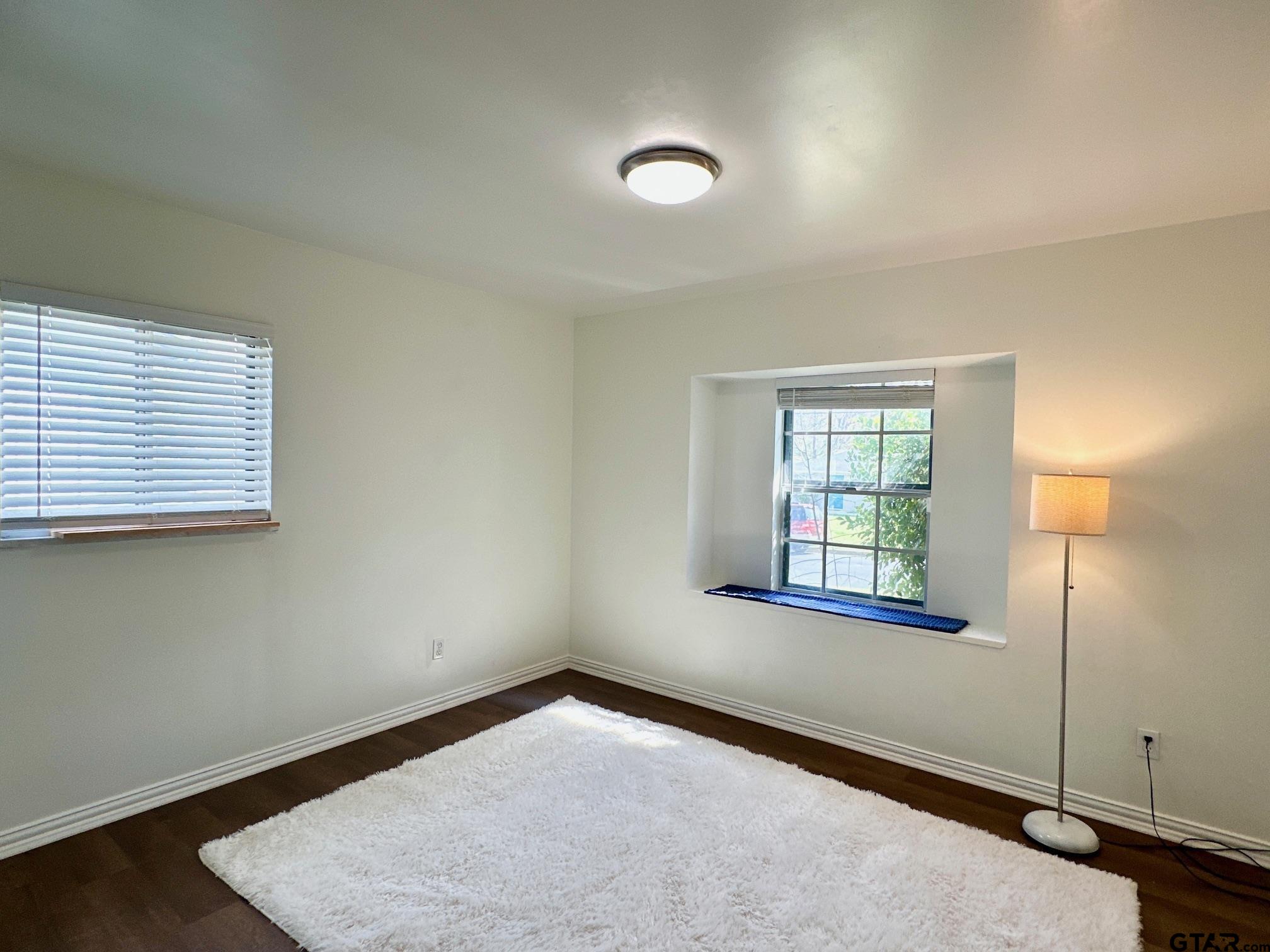 2412 East Devine Street Tyler, TX 75701 - Photo 18 of 27 an empty room with windows