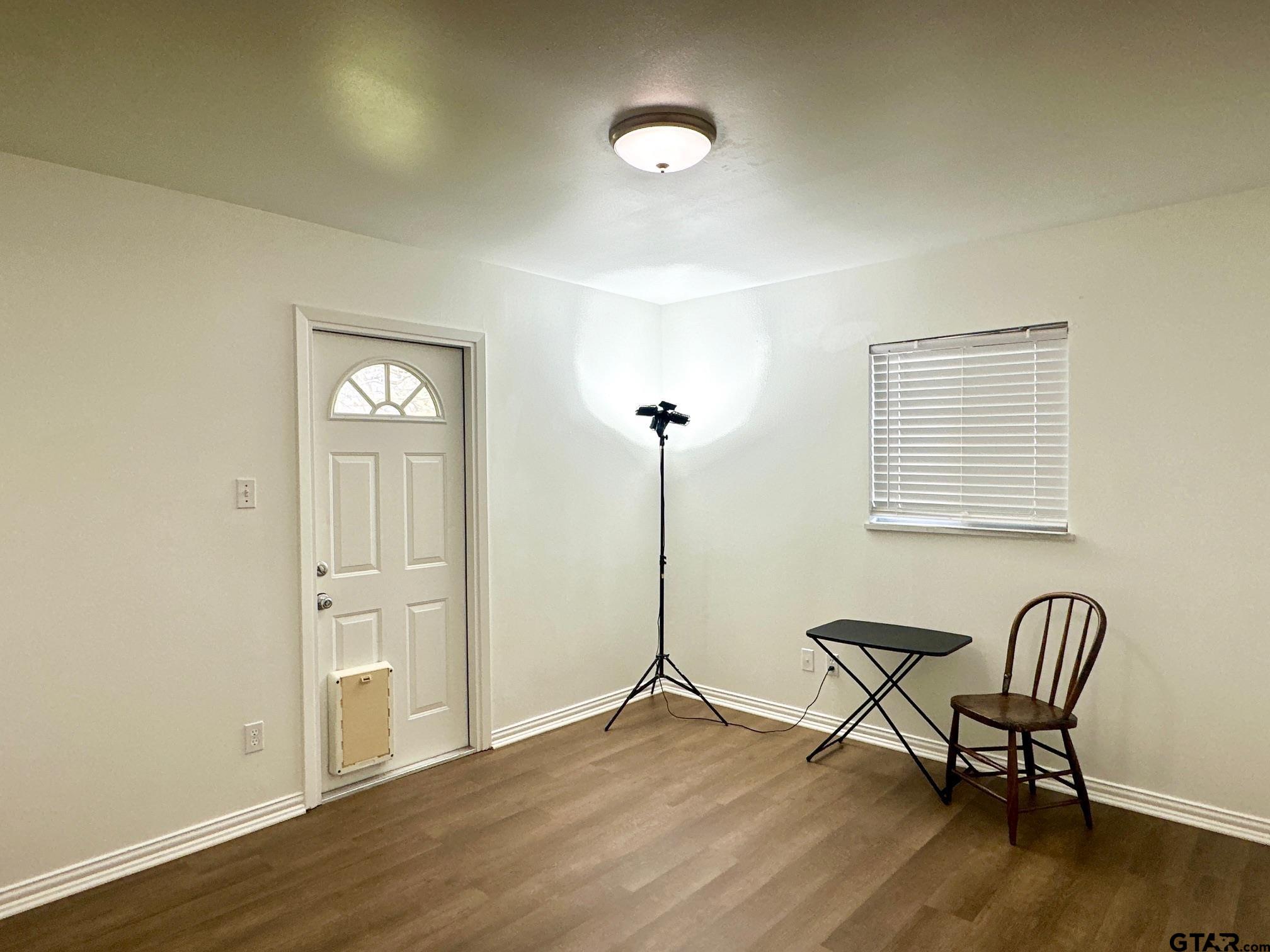 2412 East Devine Street Tyler, TX 75701 - Photo 20 of 27 a view of a livingroom with furniture and wooden floor