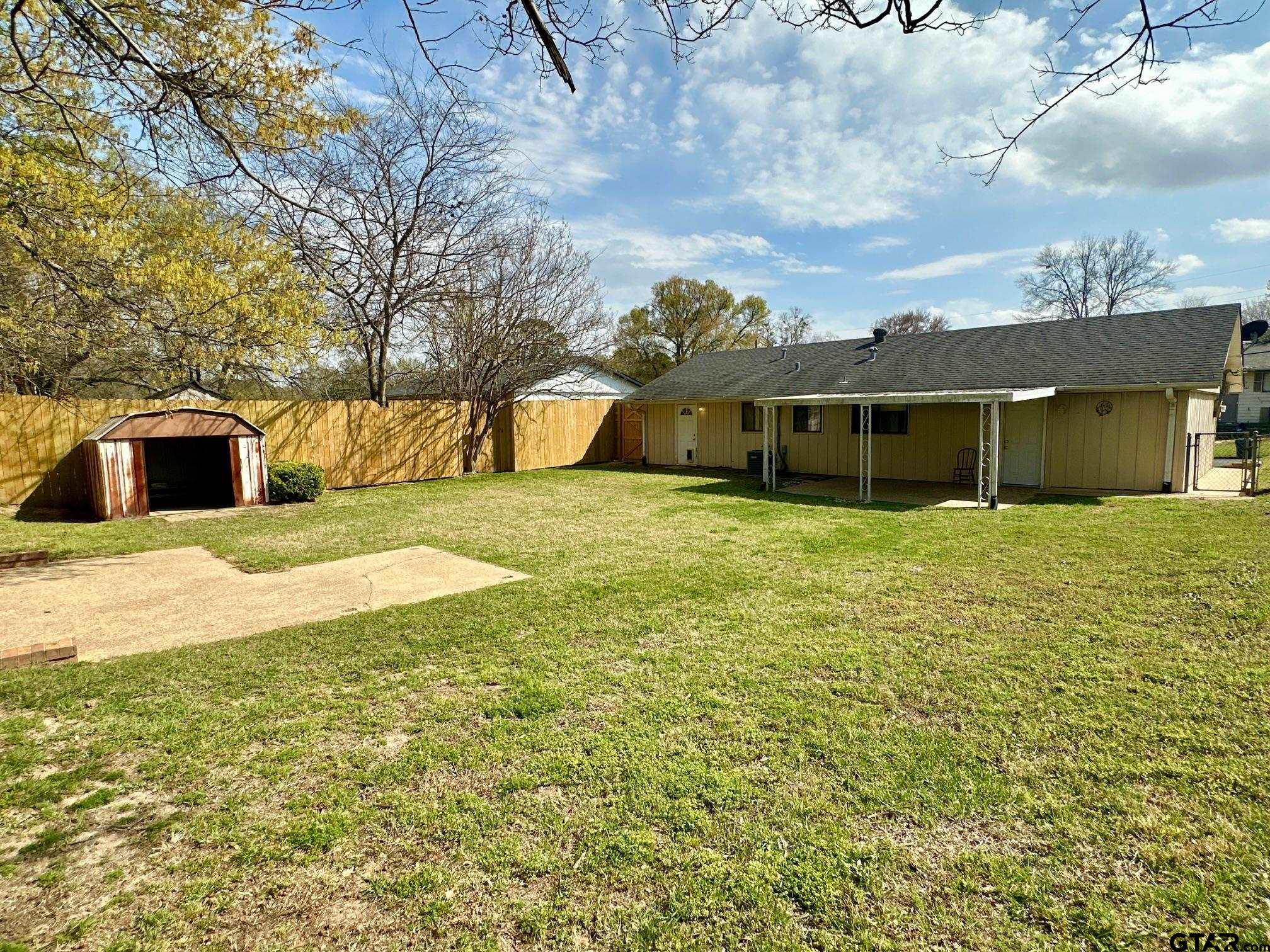 2412 East Devine Street Tyler, TX 75701 - Photo 23 of 27 a view of a house with a yard