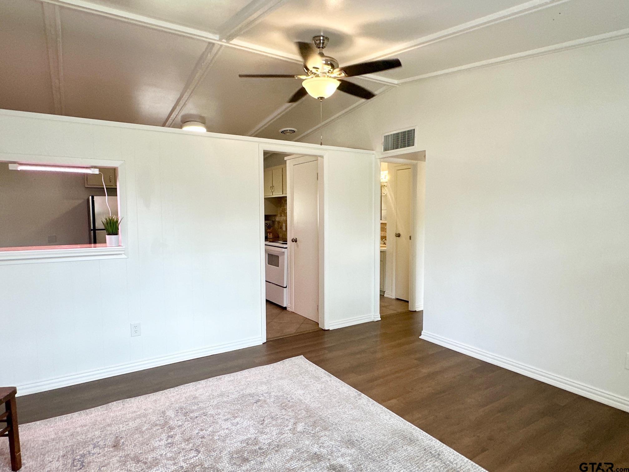 2412 East Devine Street Tyler, TX 75701 - Photo 5 of 27 a view of a hallway with a ceiling fan