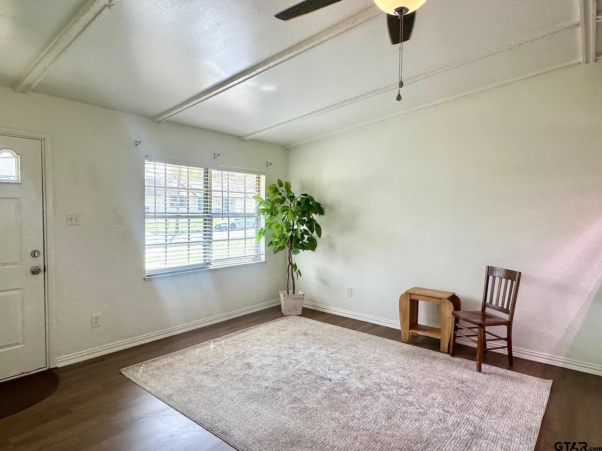 2412 East Devine Street Tyler, TX 75701 - Photo 6 of 27 a view of a room with window and wooden floor