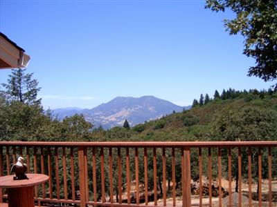 7425 Sharp Road Calistoga, CA 94515 - Photo 7 of 8 a view of city and mountain from a balcony