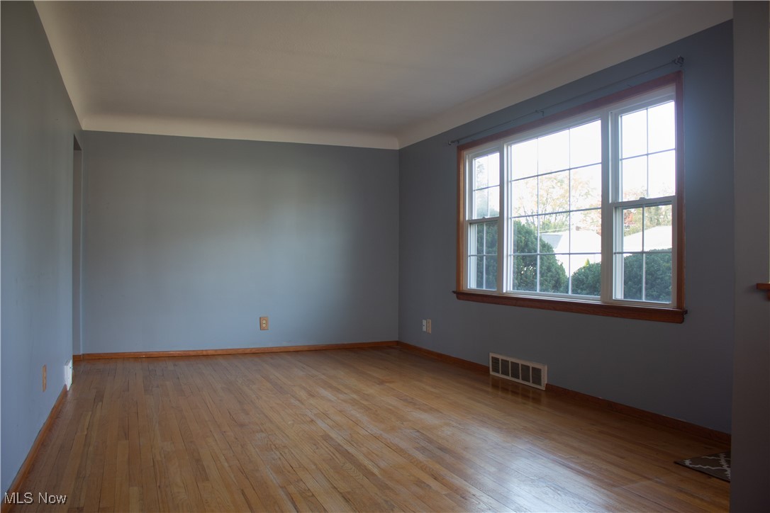 Living room featuring hardwood floors.