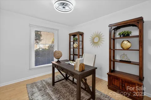 a workspace with furniture and window