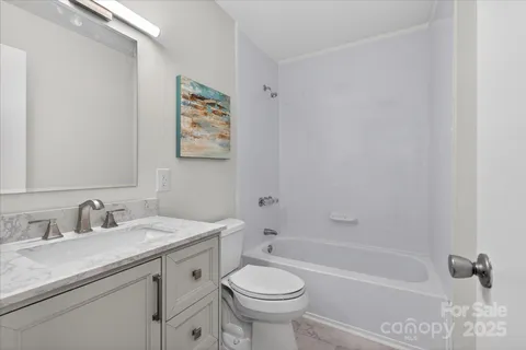 a bathroom with a sink a toilet and a bathtub