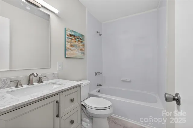 a bathroom with a sink a toilet and a bathtub