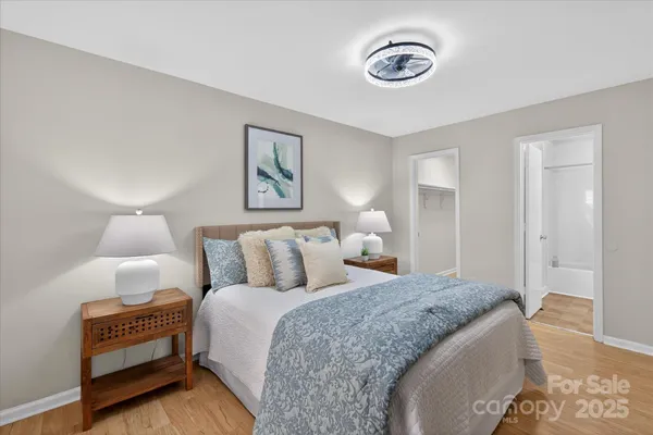 a spacious bedroom with a bed and a couch
