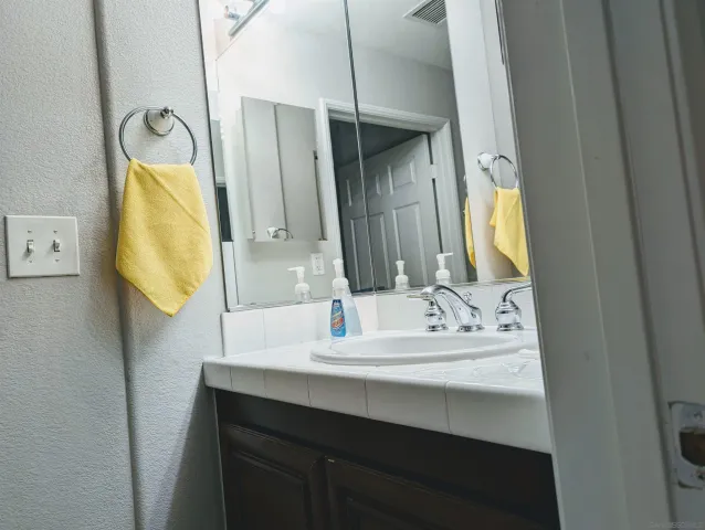 a bathroom with a sink and a mirror