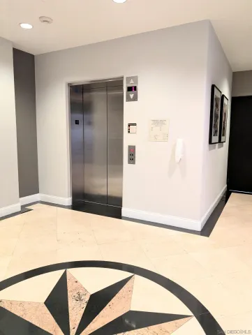 a view of a chair and tables in the patio