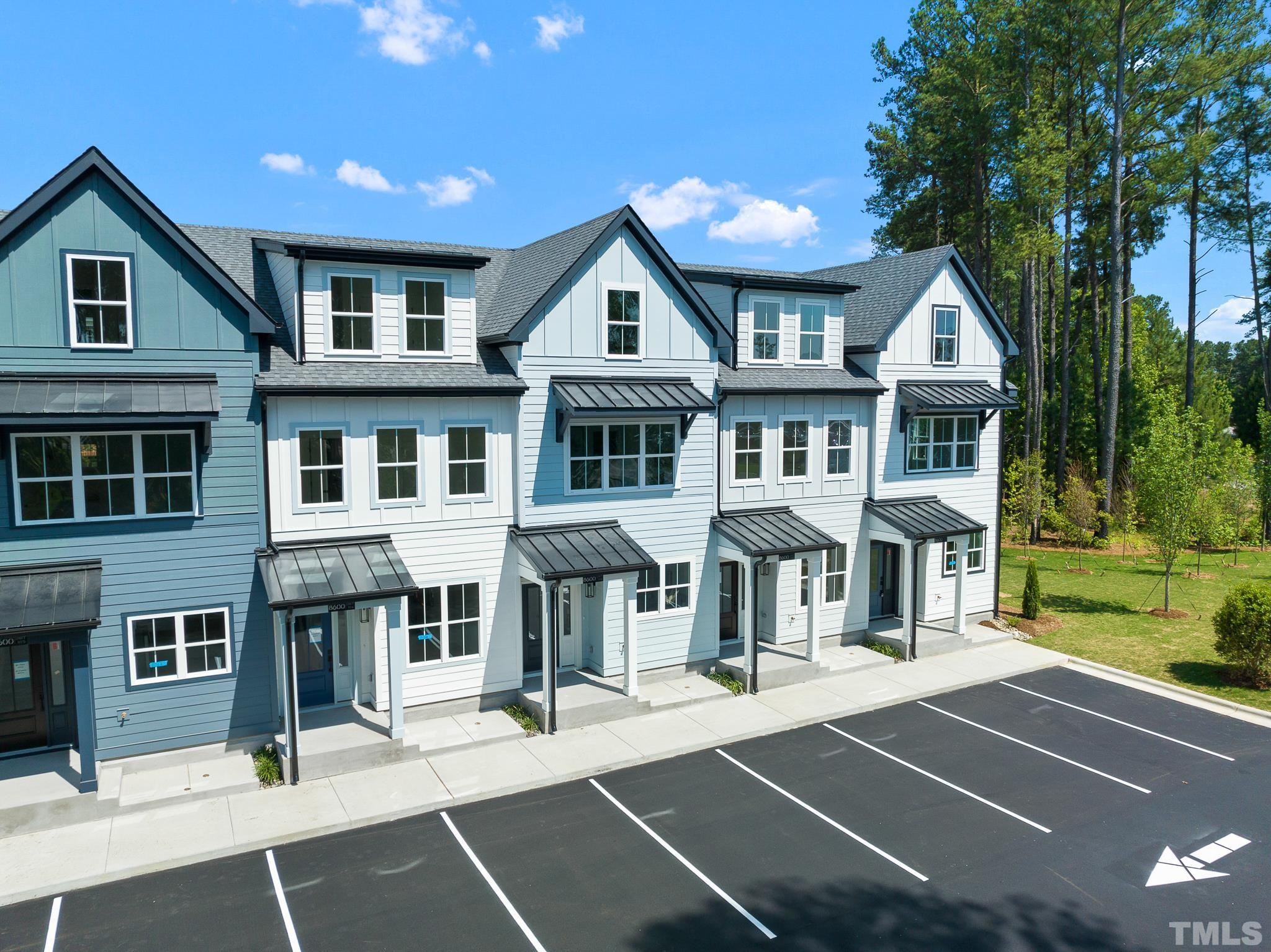 8610 Brushfoot Way, Unit 101 Raleigh, NC 27616 - Photo 32 of 42 a view of a building with a outdoor space