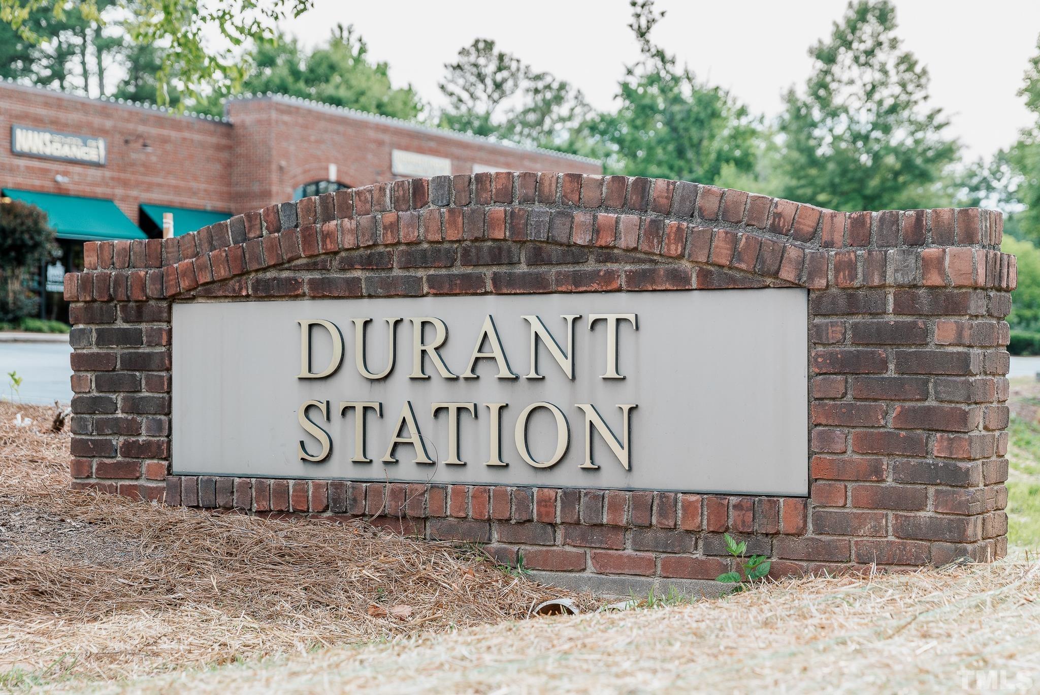 8610 Brushfoot Way, Unit 101 Raleigh, NC 27616 - Photo 37 of 42 a sign on the side of a building