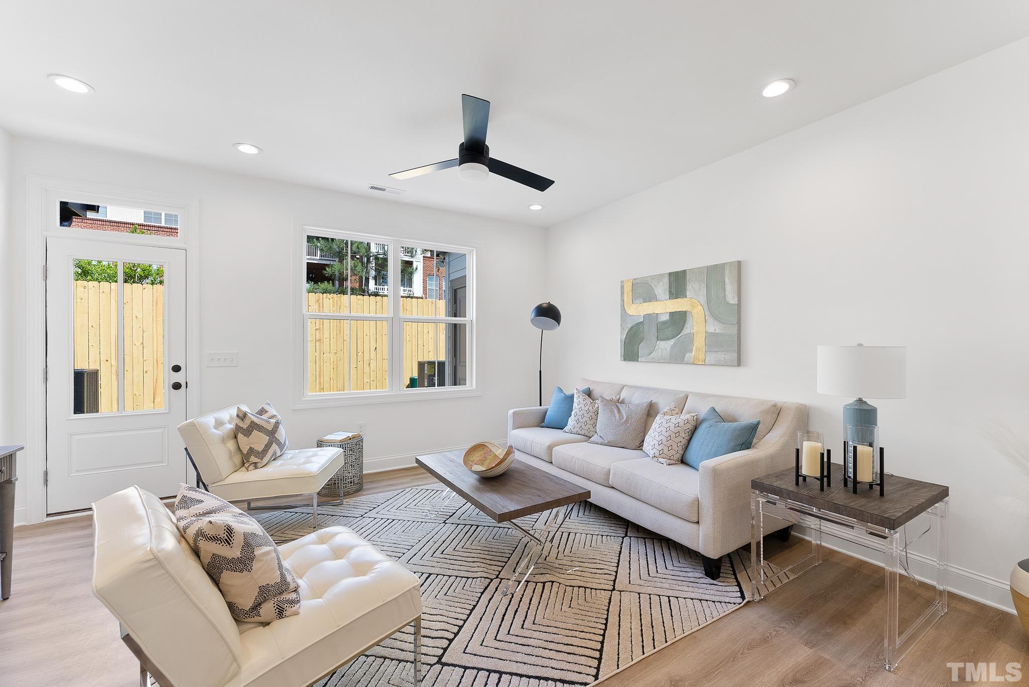 8610 Brushfoot Way, Unit 101 Raleigh, NC 27616 - Photo 8 of 42 a living room with furniture and a window