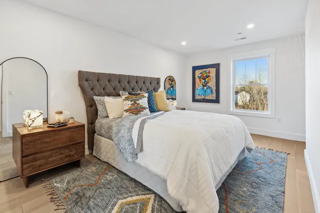 a bed room with a bed and a painting