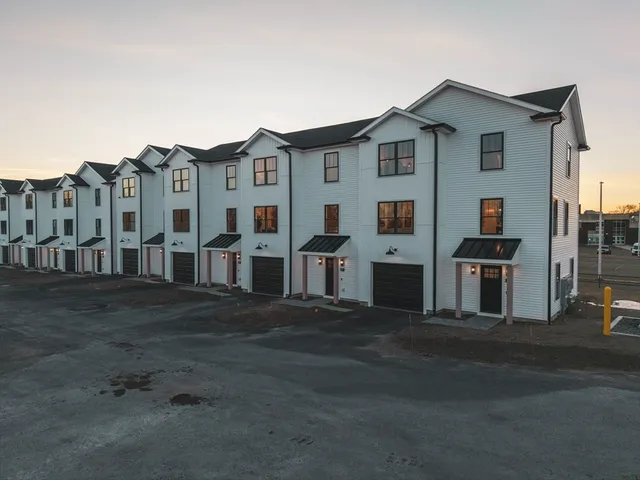 a front view of residential houses with street