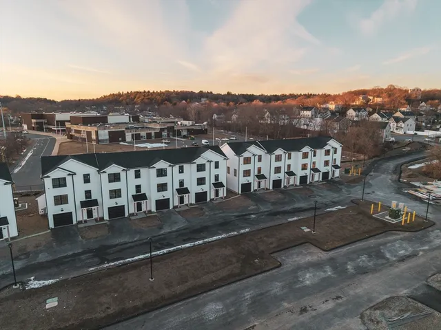 a view of a city that has lots of street and some houses