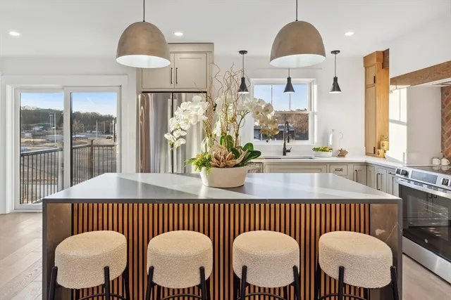 a kitchen with a table and chairs