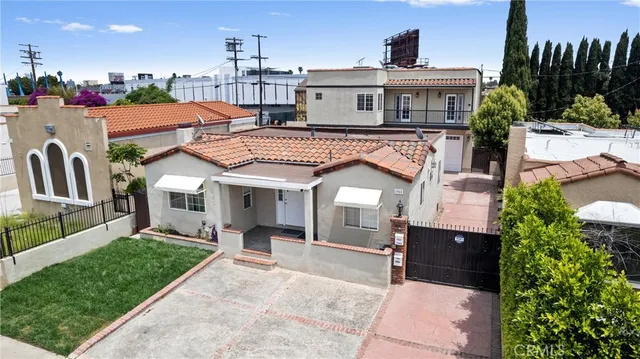 a view of house with yard outdoor seating and entertaining space