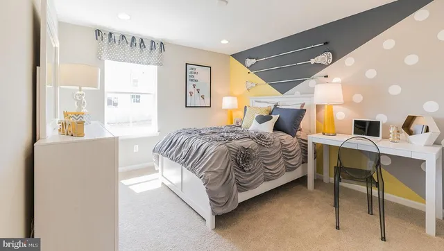 a bedroom with a bed and a table in it