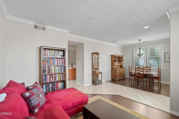 a bedroom with furniture and a book shelf