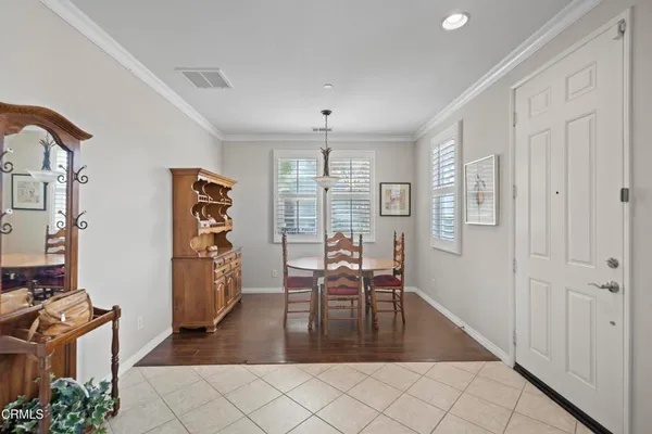 a view of a livingroom with furniture window and wooden floor